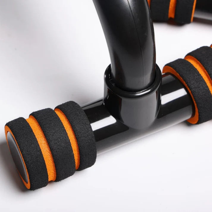 Black and orange exercise equipment on a white background
