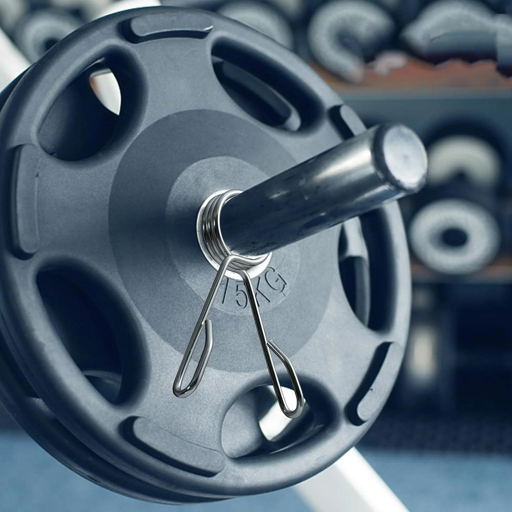 Woman exercising with blue dumbbells on a step platform in a gym.