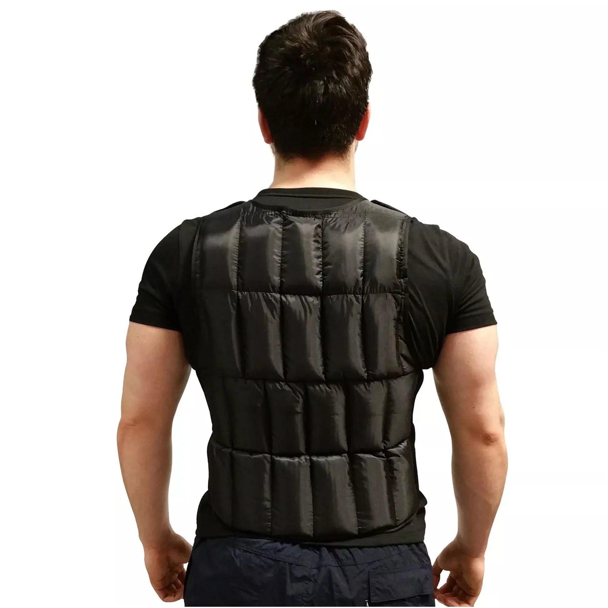 Person wearing a black weighted vest on a white background