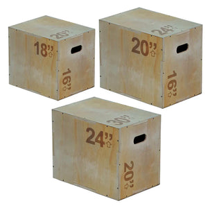 Three wooden exercise boxes with height markings on a white background